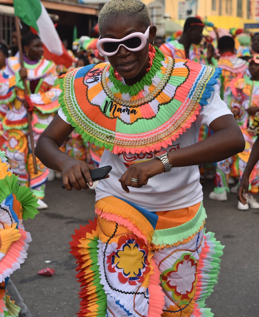 A bright carnival performer in a colorful costume.