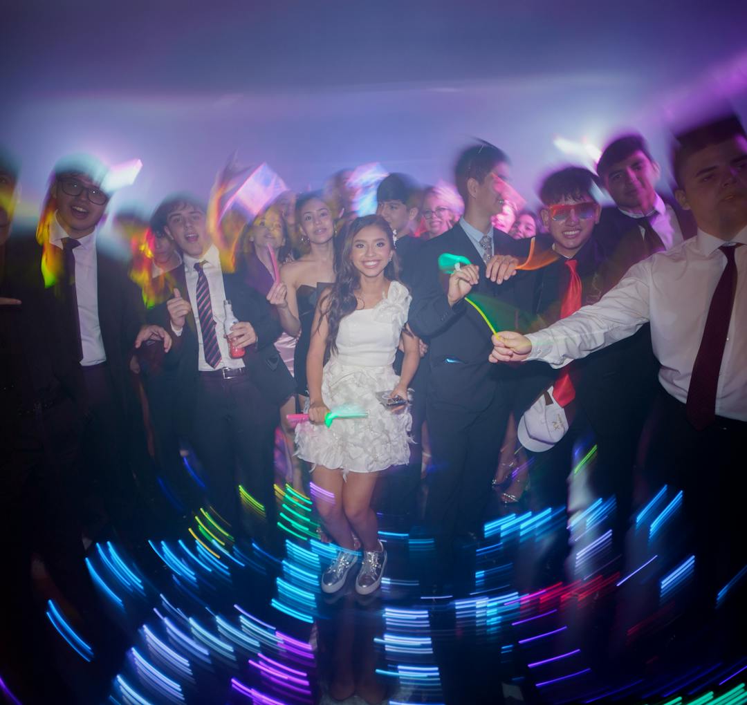 A lively dance floor with colorful party lights.